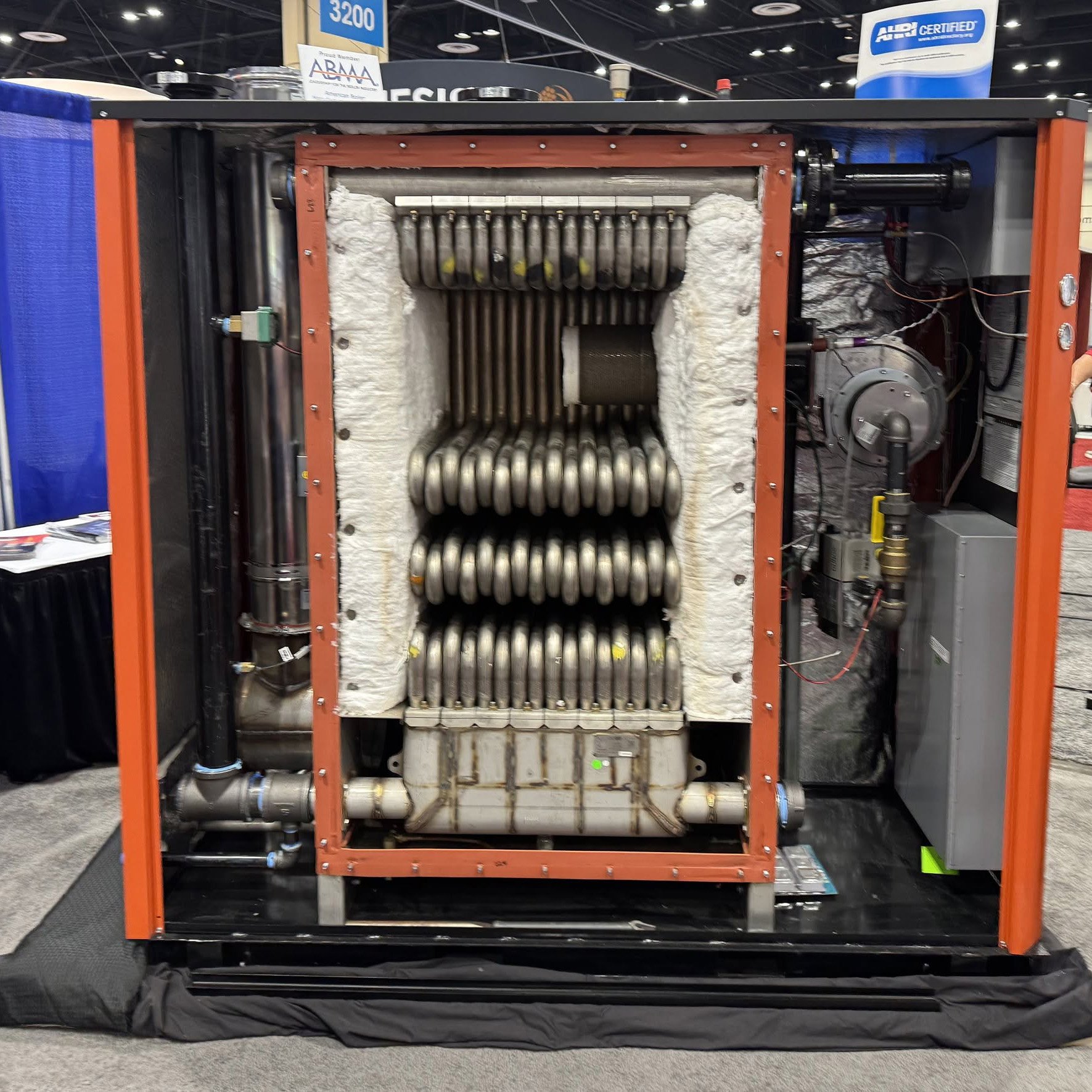 Close-up view of industrial boiler internal tubing at trade show